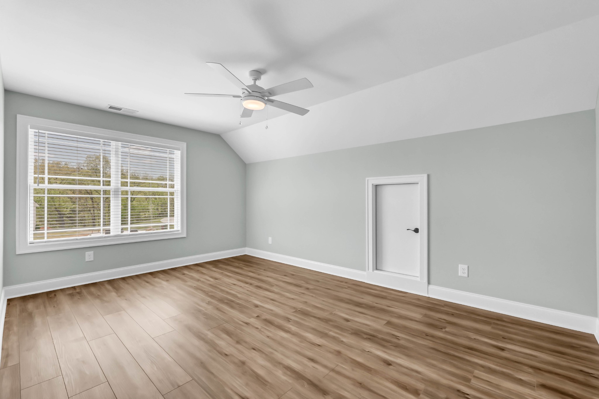 282 Martha Morgan Way Cunningham, TN 37052 - Photo 29 of 36 a view of empty room with wooden floor and fan