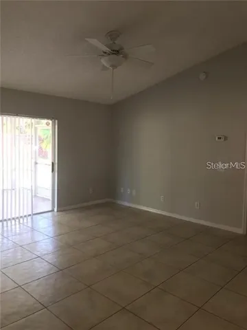 an empty room with a empty space and windows