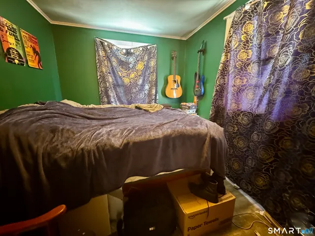 a view of gym equipment with wooden floor
