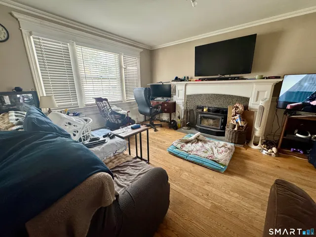a view of a hallway with couch and chandelier