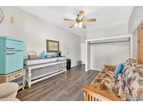 a bedroom with a bed and a mirror