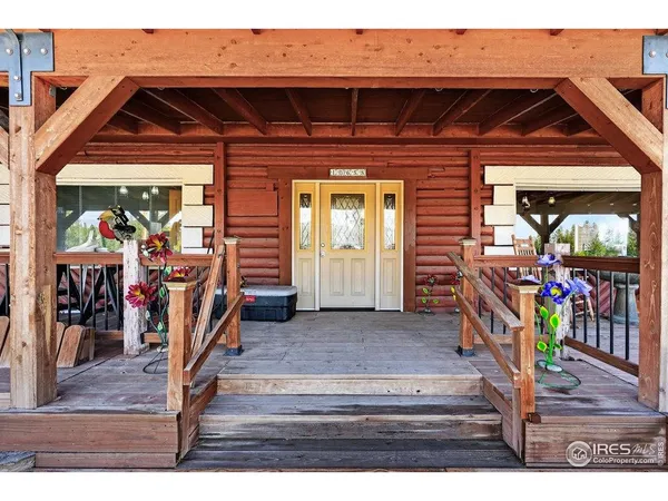a view of a patio with wooden floor