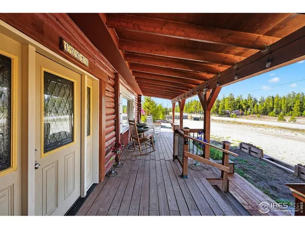a view of a swimming pool with a table and chairs