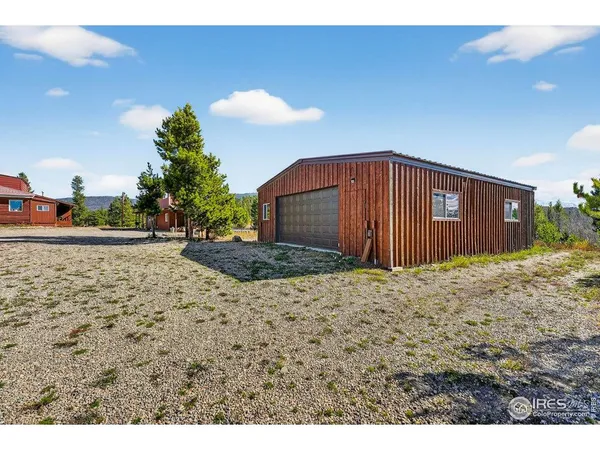 a view of a city from a balcony with a lake