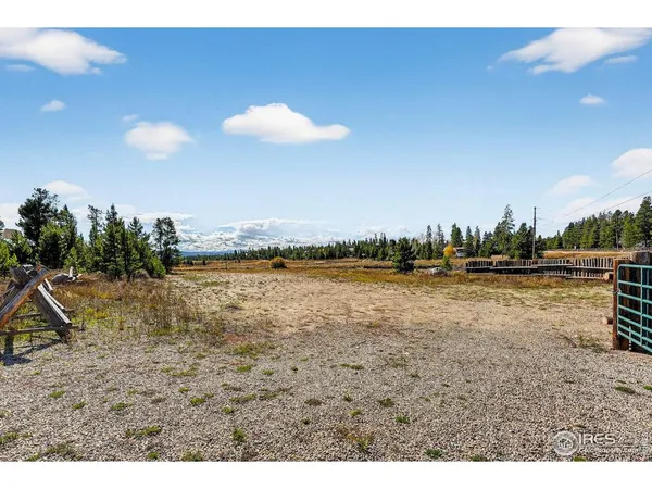 a view of a balcony with wooden floor