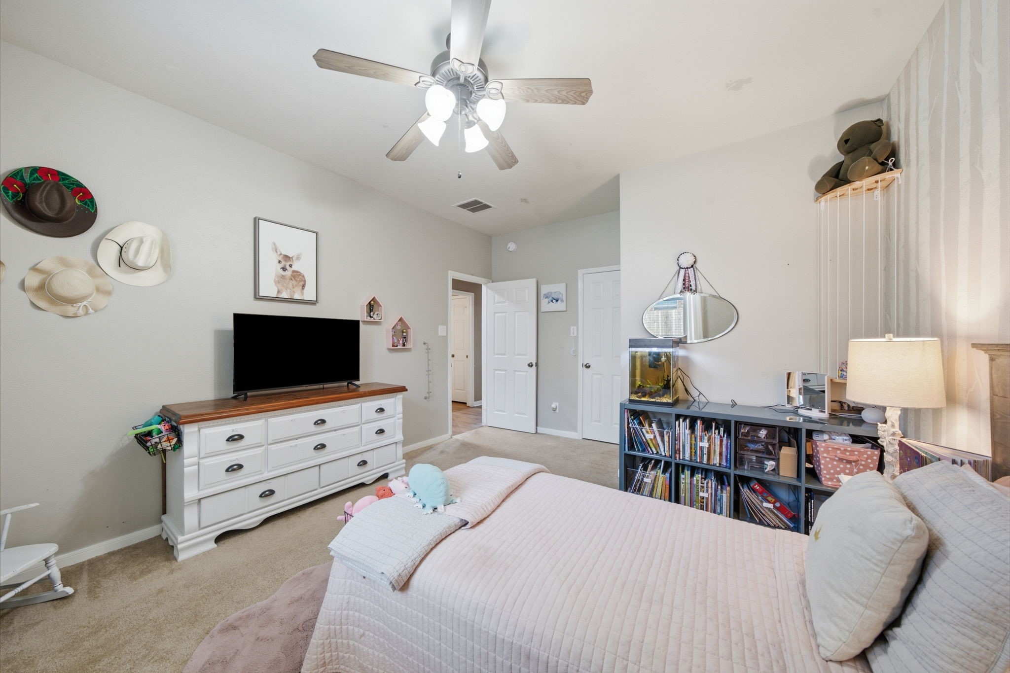 8911 Henrico Lane Rosenberg, TX 77469 - Photo 20 of 45 a bedroom with furniture and a flat screen tv