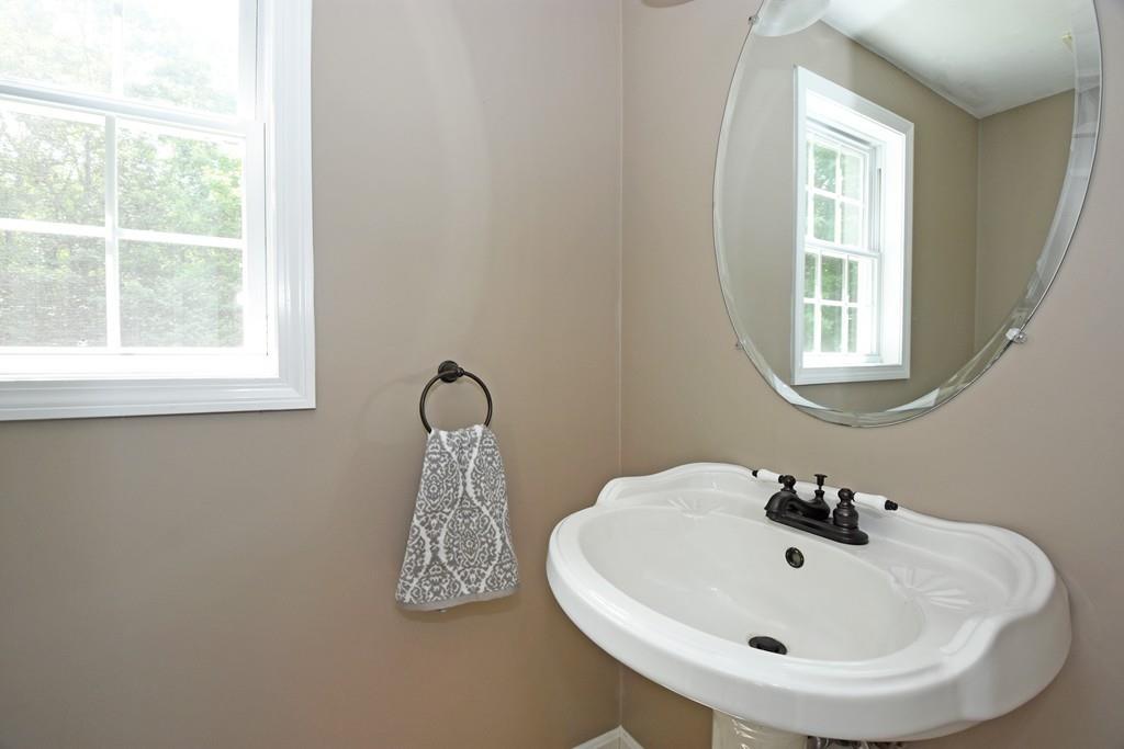 253 Pommogussett Road Rutland, MA 01543 - Photo 11 of 25 a bathroom with a sink and a window