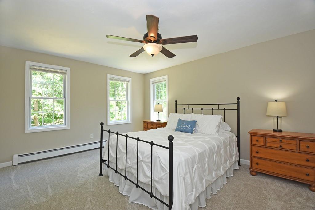 253 Pommogussett Road Rutland, MA 01543 - Photo 12 of 25 a bedroom with a bed and a window