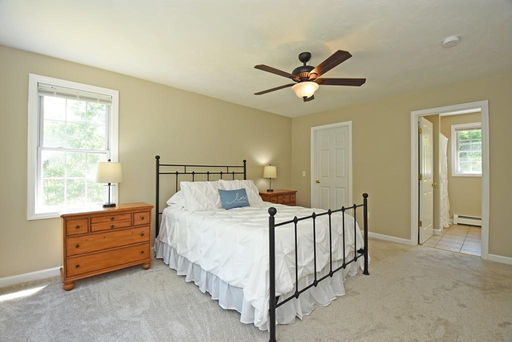 253 Pommogussett Road Rutland, MA 01543 - Photo 13 of 25 a bedroom with a bed and a window