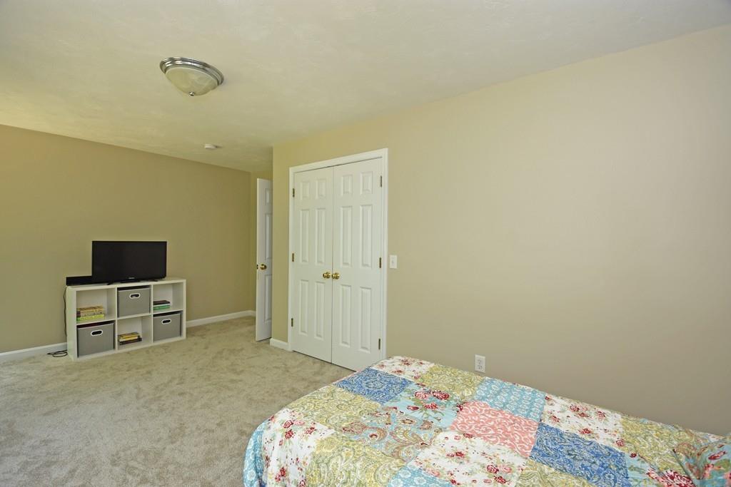 253 Pommogussett Road Rutland, MA 01543 - Photo 17 of 25 a bedroom with a bed and a flat screen tv