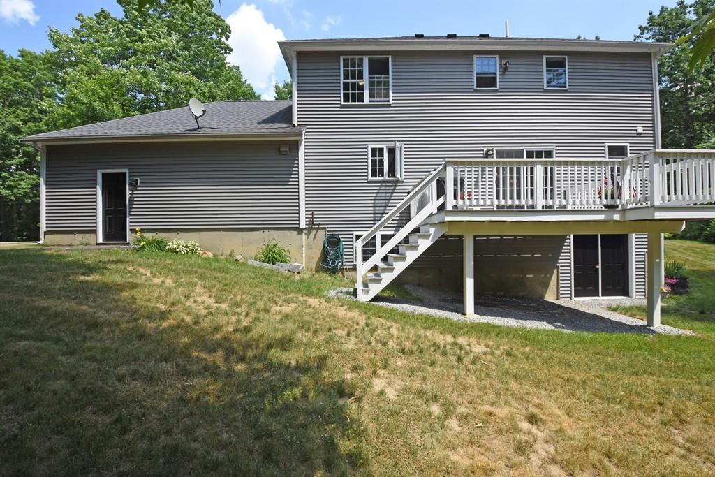 253 Pommogussett Road Rutland, MA 01543 - Photo 22 of 25 a view of a house with a yard