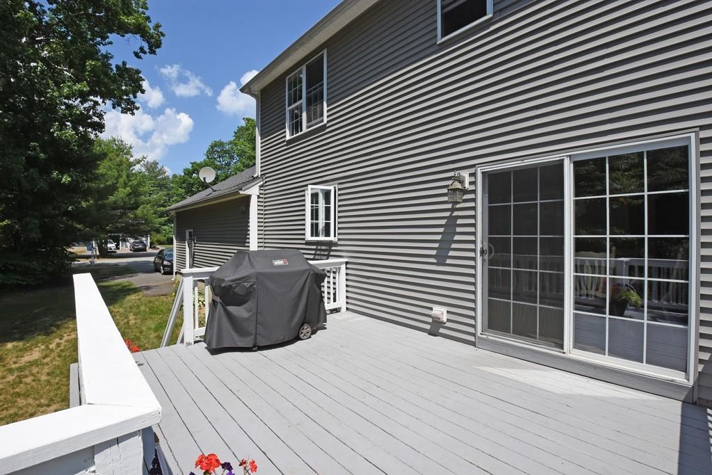 253 Pommogussett Road Rutland, MA 01543 - Photo 23 of 25 a view of a patio with couches chairs and wooden floor