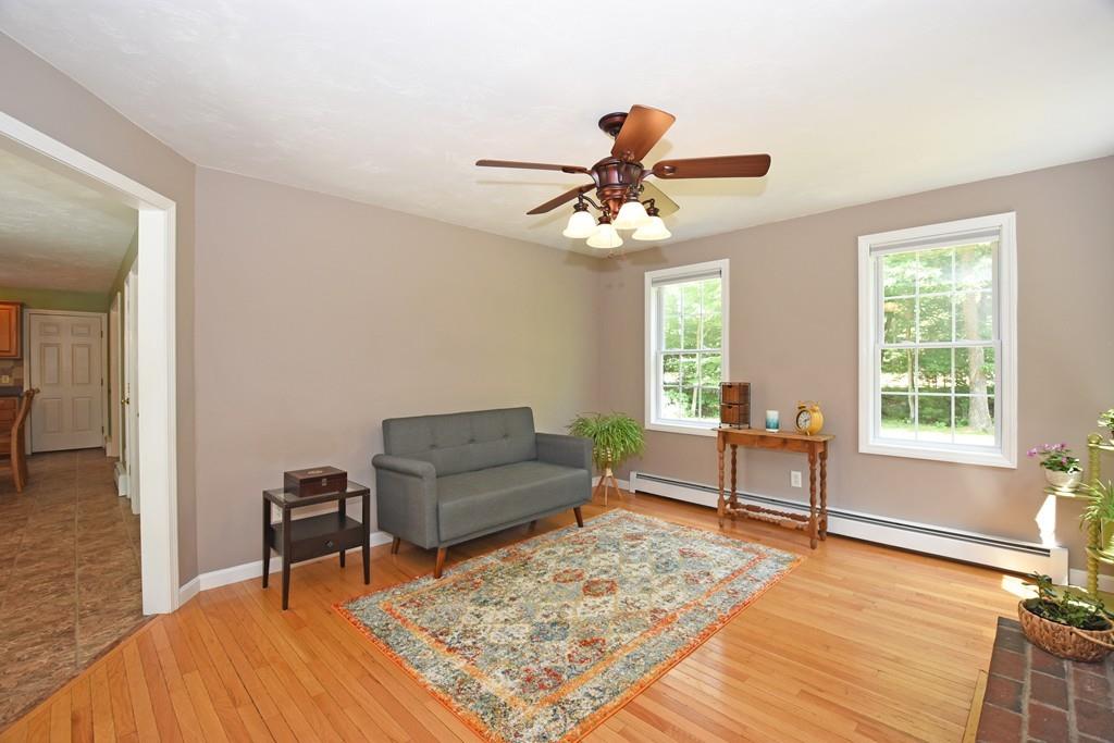 253 Pommogussett Road Rutland, MA 01543 - Photo 10 of 25 a living room with furniture and a wooden floor