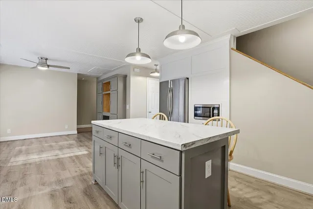 a bathroom with a sink a vanity and a mirror
