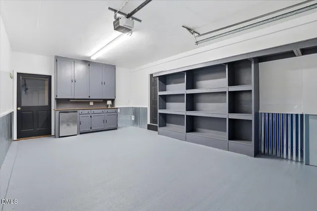 a living room with closet and a ceiling fan