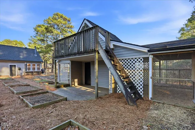 a front view of a house with wooden stairs