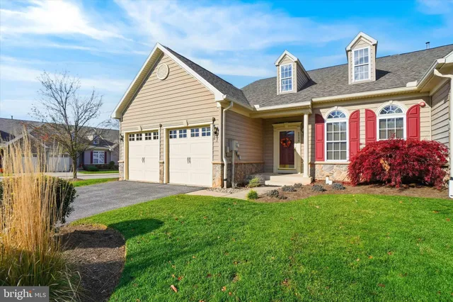a front view of house with yard barbeque and outdoor seating