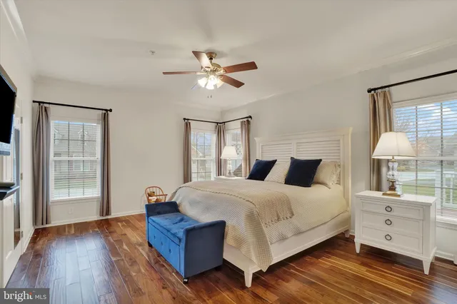 a view of a workspace with furniture and a bookshelf