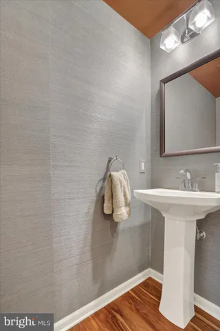 a bathroom with a shower a toilet and sink