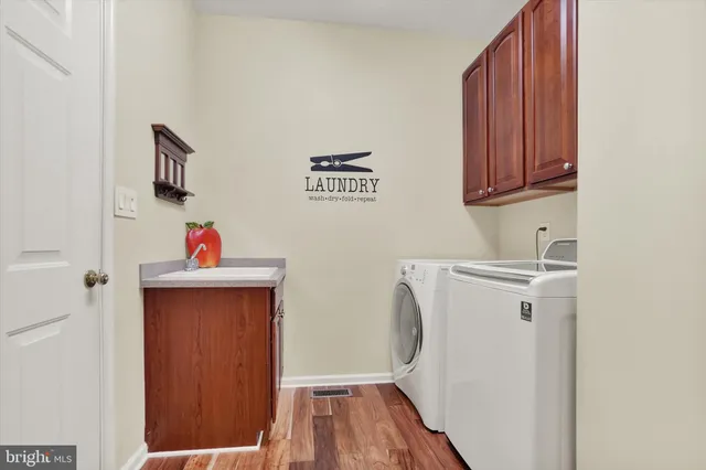 a bathroom with a sink a mirror and vanity