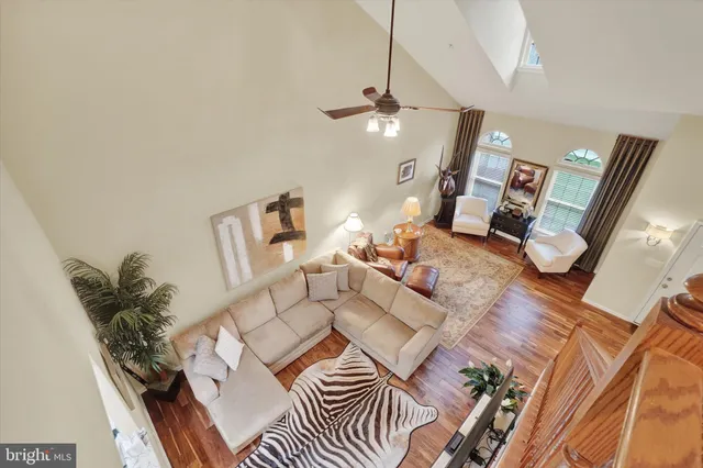 a utility room with wooden floor washer and dryer