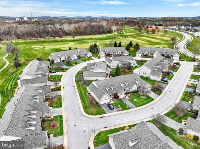 an aerial view of a house with outdoor space swimming pool and mountains