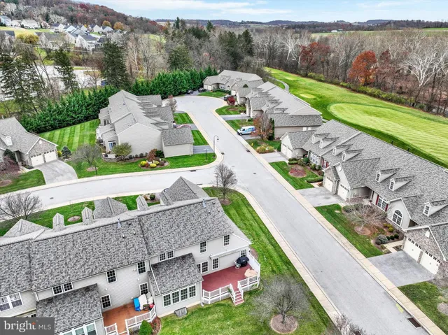 an aerial view of a house with a garden