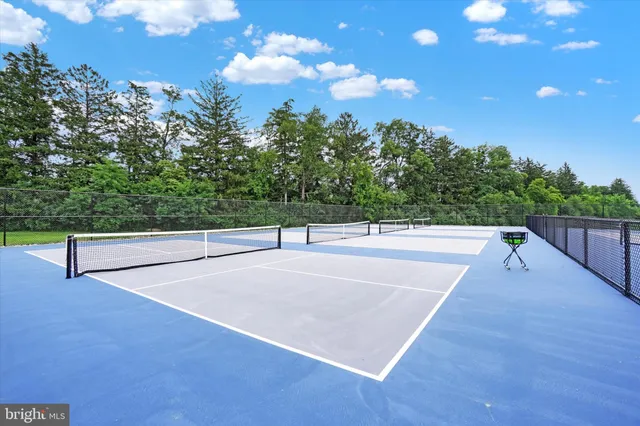 a view of a swimming pool with an outdoor space and seating area