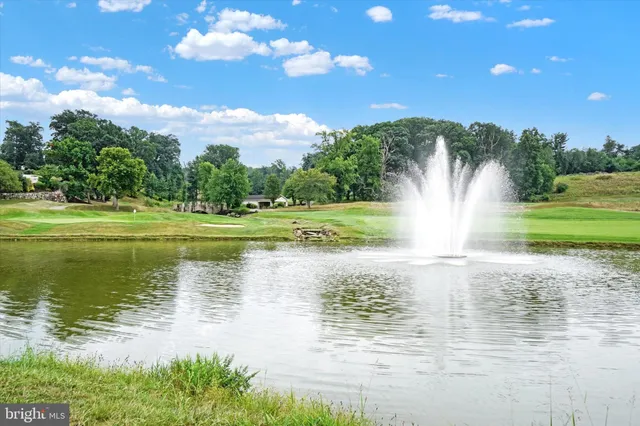 a view of a lake with a big yard