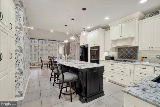 a living room with furniture a flat screen tv and a large window