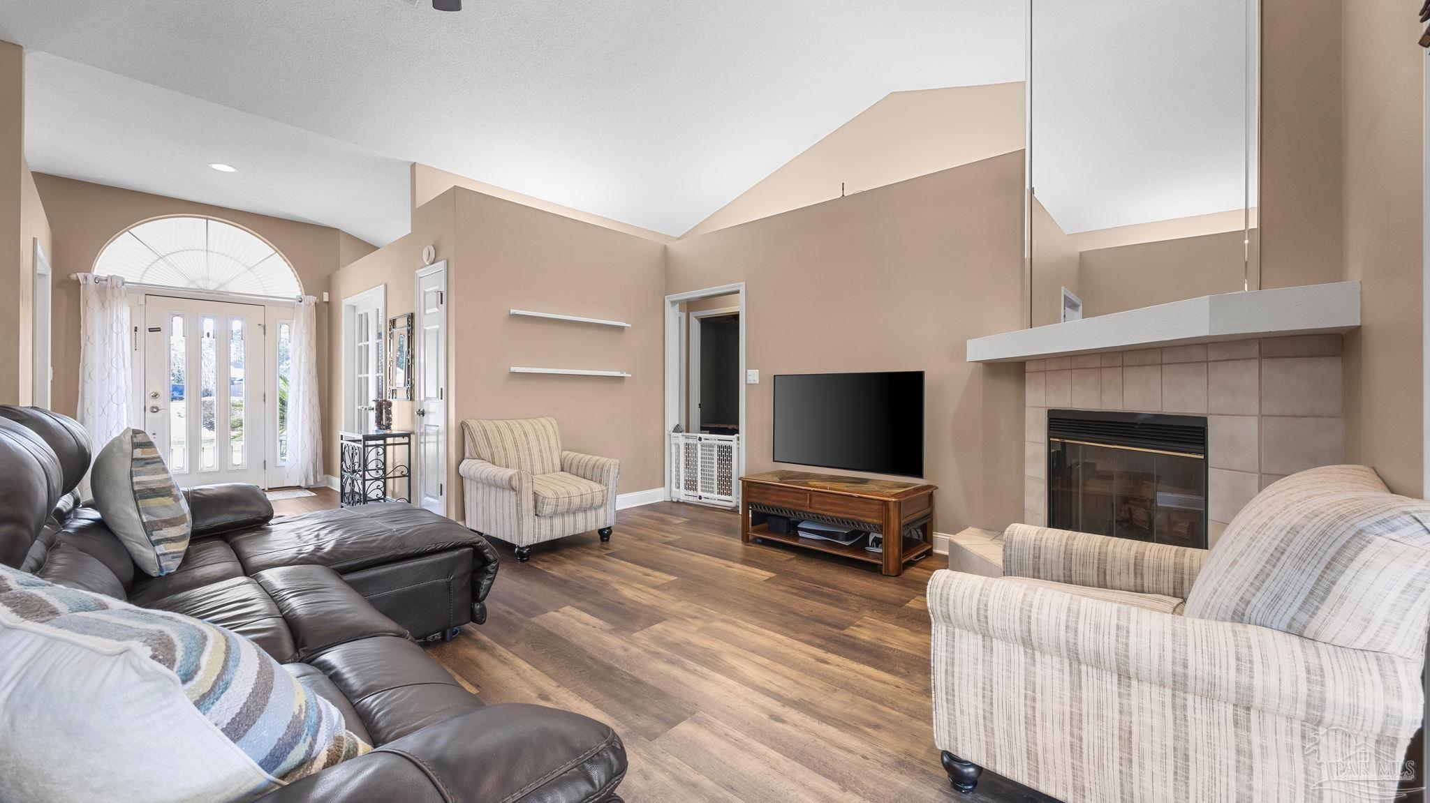 10305 Nightwind Circle Cantonment, FL 32533 - Photo 14 of 46 Cozy wood-burning fireplace with tiled surround.