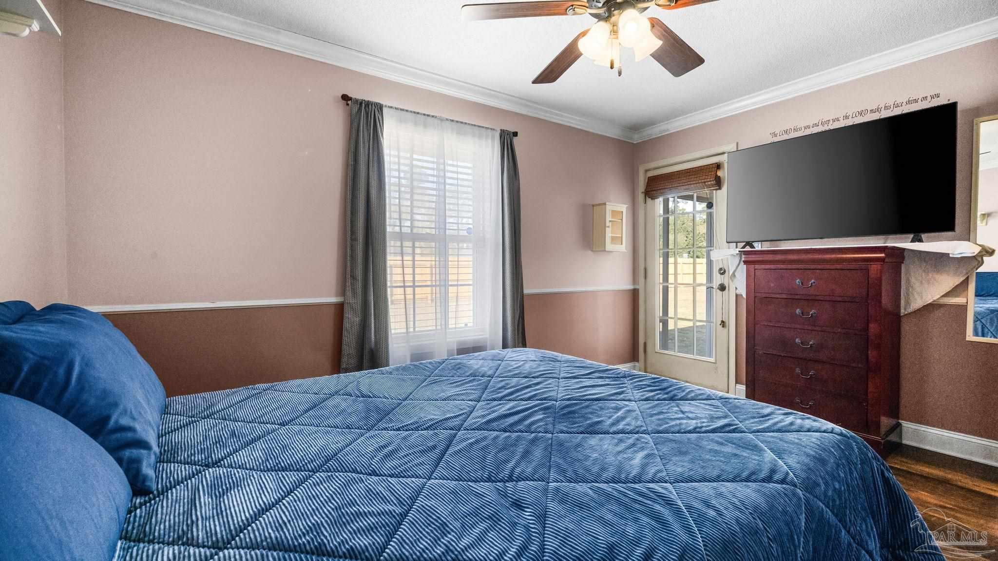 10305 Nightwind Circle Cantonment, FL 32533 - Photo 16 of 46 Ceiling fan and exterior door to screened porch.