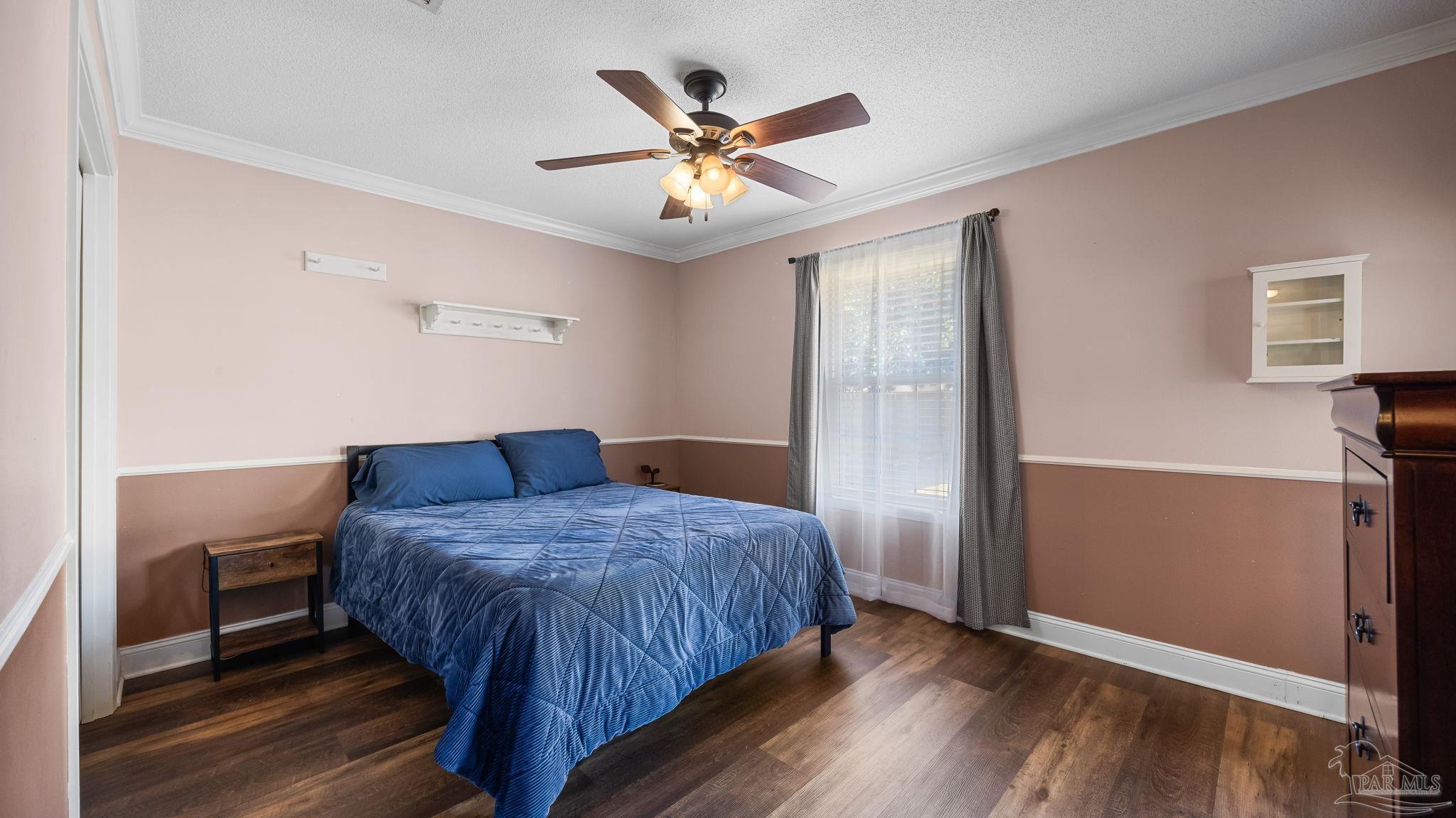 10305 Nightwind Circle Cantonment, FL 32533 - Photo 28 of 46 Ceiling fan, window, and wood-look floors.