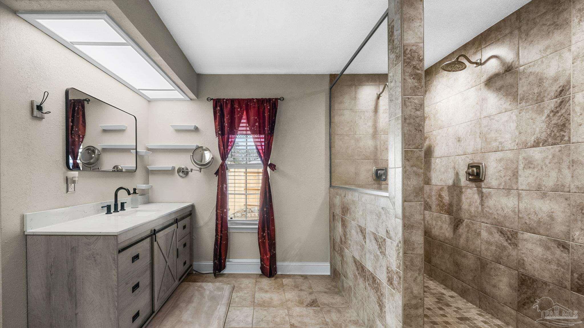 10305 Nightwind Circle Cantonment, FL 32533 - Photo 30 of 46 Spacious tiled shower with rain shower head.