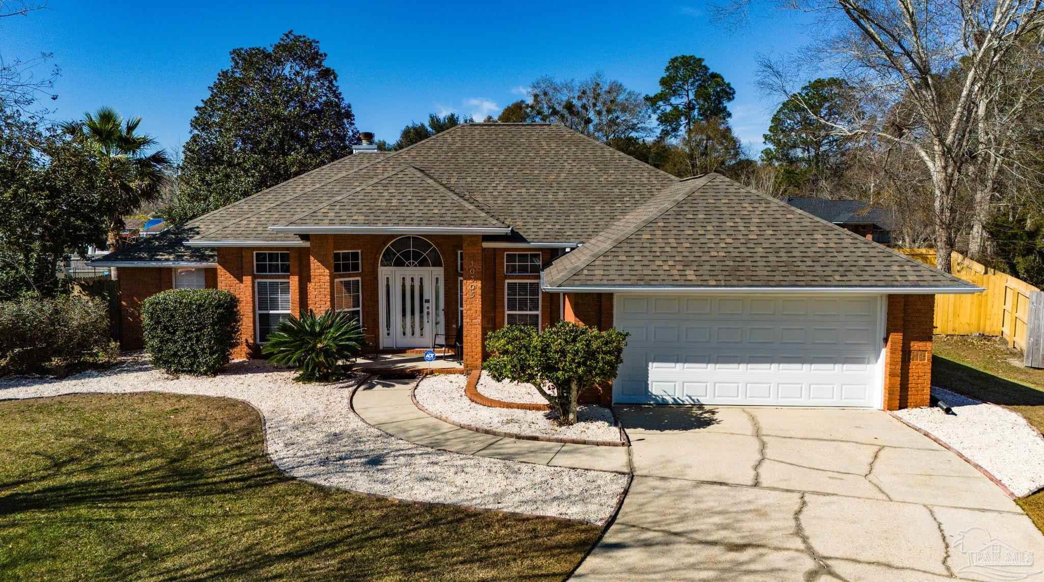 10305 Nightwind Circle Cantonment, FL 32533 - Photo 38 of 46 Front view showing curb appeal and 2023 roofline.