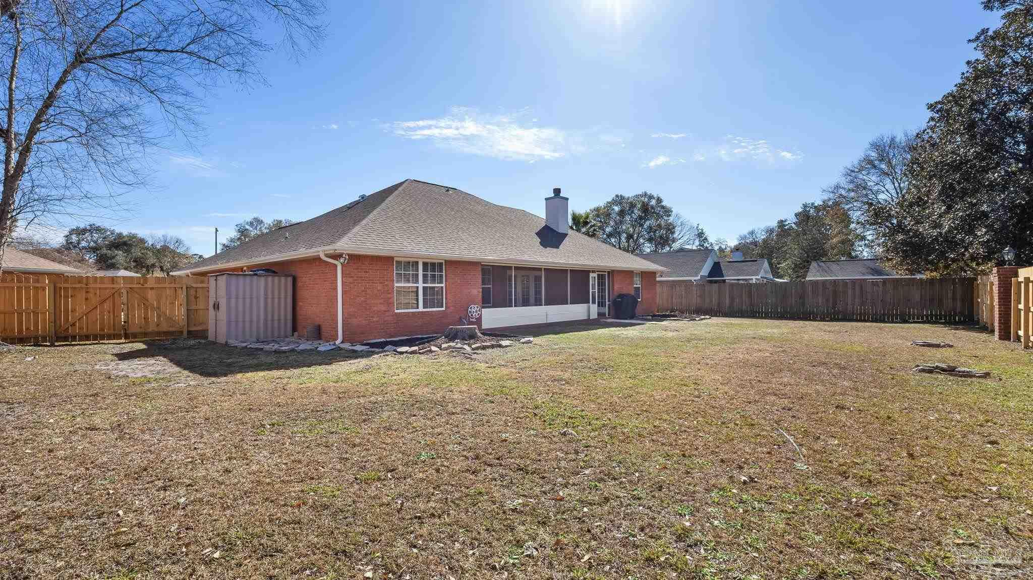 10305 Nightwind Circle Cantonment, FL 32533 - Photo 7 of 46 Screened porch spans the back of the home.