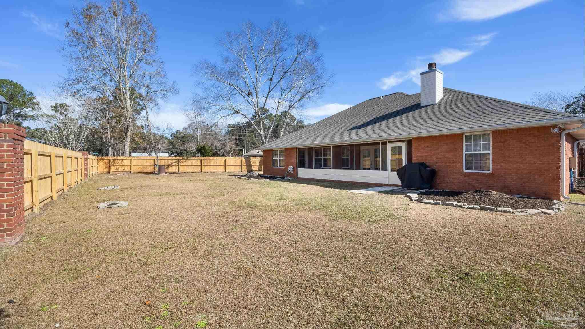 10305 Nightwind Circle Cantonment, FL 32533 - Photo 8 of 46 Spacious fenced yard with room to play or garden.