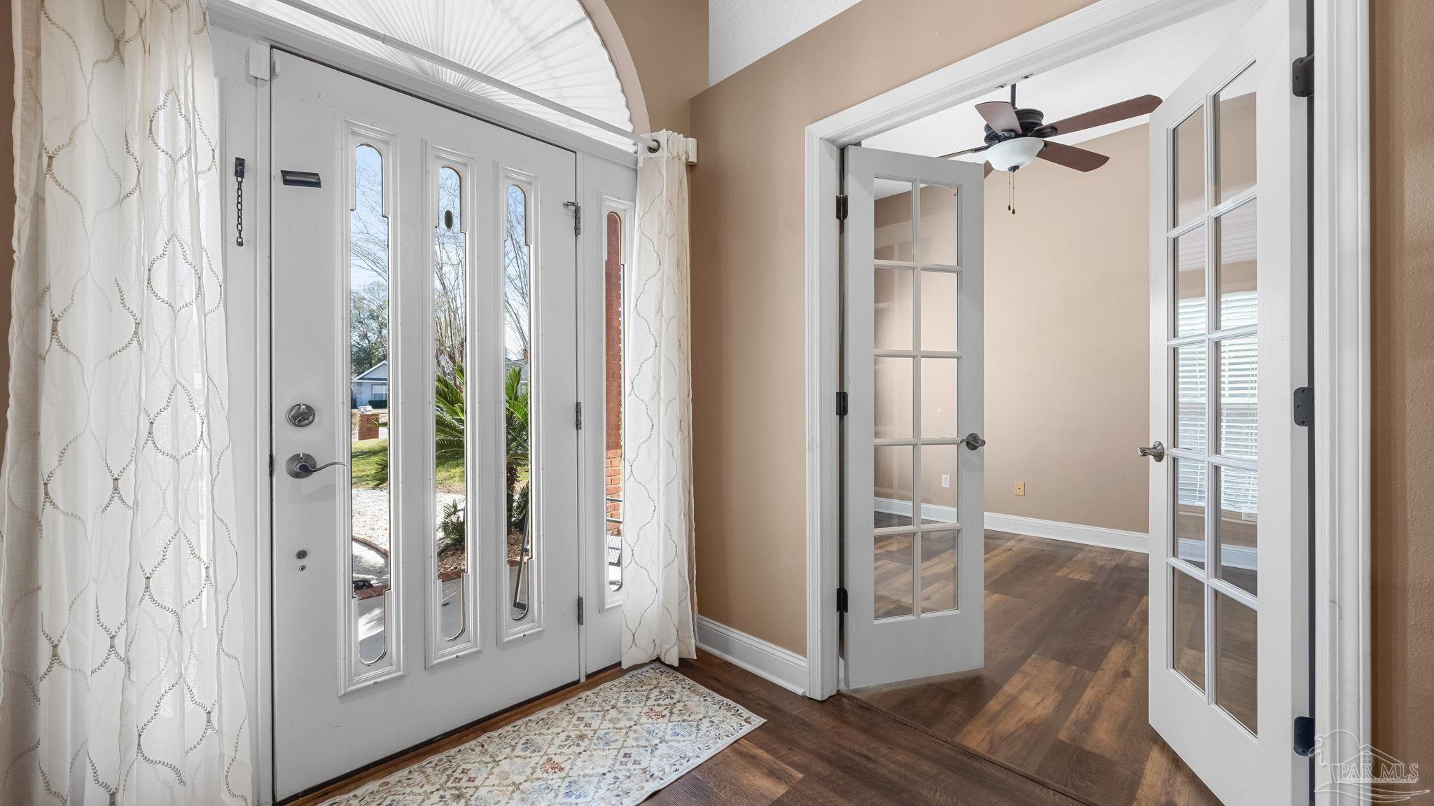 10305 Nightwind Circle Cantonment, FL 32533 - Photo 10 of 46 Arched transom and glass-inset doors.