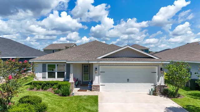 a front view of a house with garden