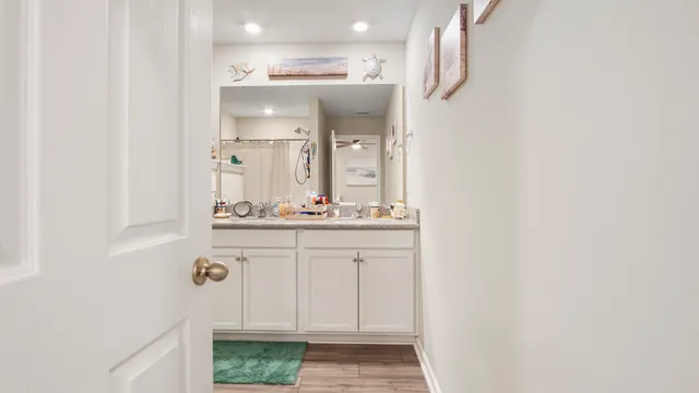 a bathroom with a shower and a sink