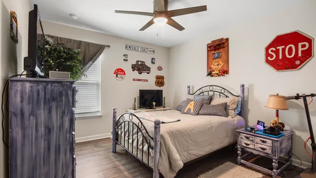 a bedroom with a bed and a window