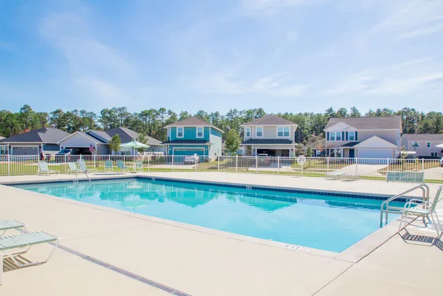 a view of a balcony with wooden floor and lake view