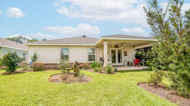 a view of a house with swimming pool and porch with furniture