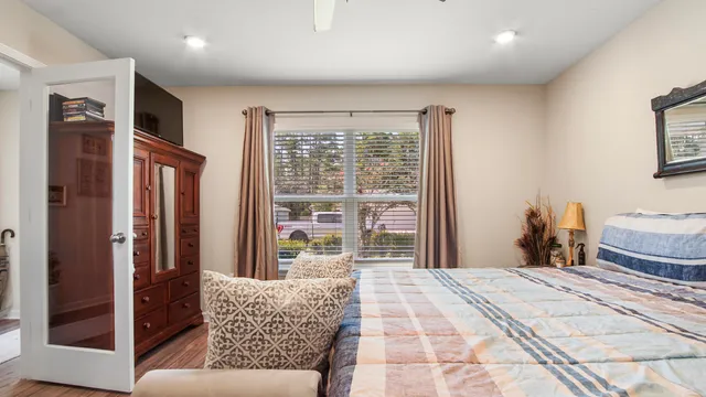 a bedroom with furniture and a window