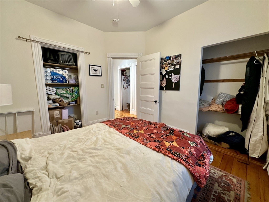 11 Sheridan Street, Unit 2 Boston, MA 02130 - Photo 16 of 17 a bedroom with a bed and a large mirror