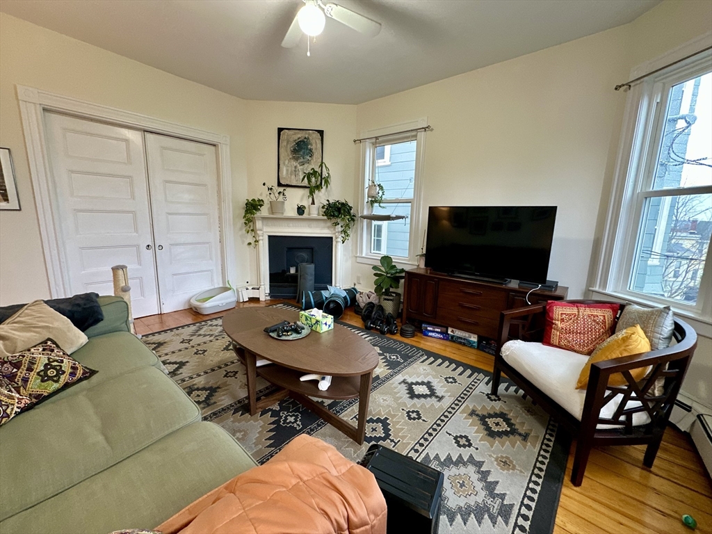 11 Sheridan Street, Unit 2 Boston, MA 02130 - Photo 2 of 17 a living room with furniture and a flat screen tv