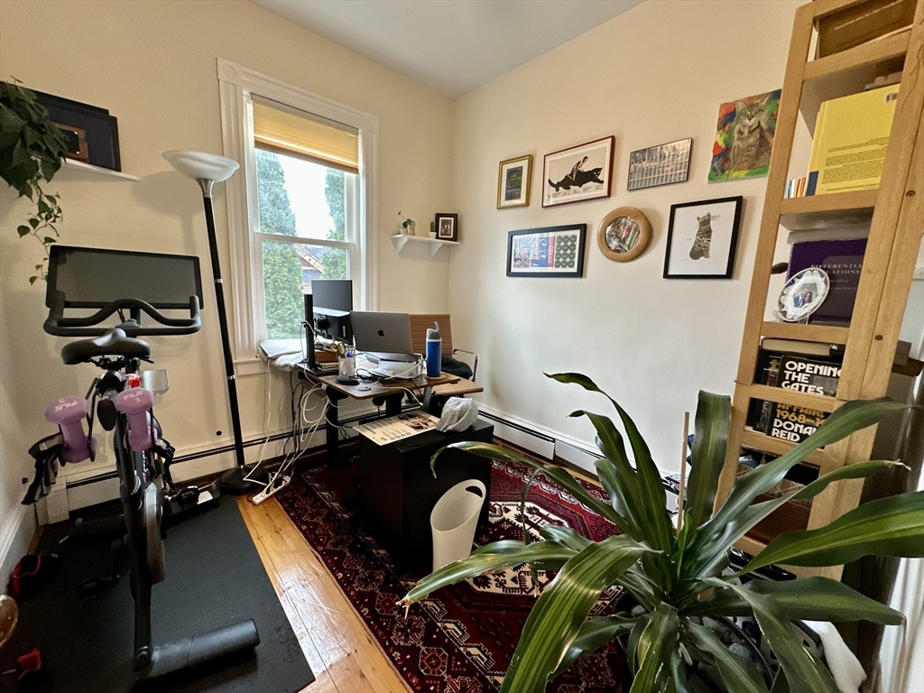 11 Sheridan Street, Unit 2 Boston, MA 02130 - Photo 9 of 17 a room with gym equipment and a large window
