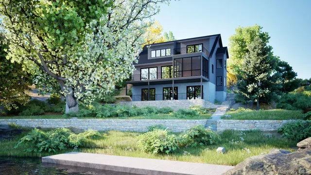 a view of a house with a tree in front