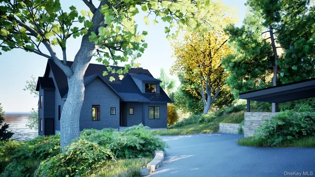 front view of a house with a tree
