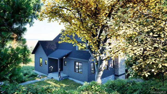 front view of a house with a tree